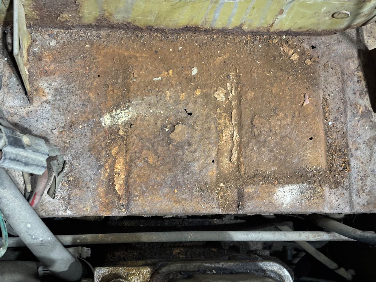 1974 Triumph TR6 battery compartment.